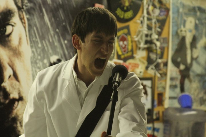 Musician Doctor Striker screams into the crowd, telling them exactly how to start a music festival.